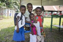 A family wait to receive the Ebola vaccine at the MSF Ebola transit centre in Itipo.