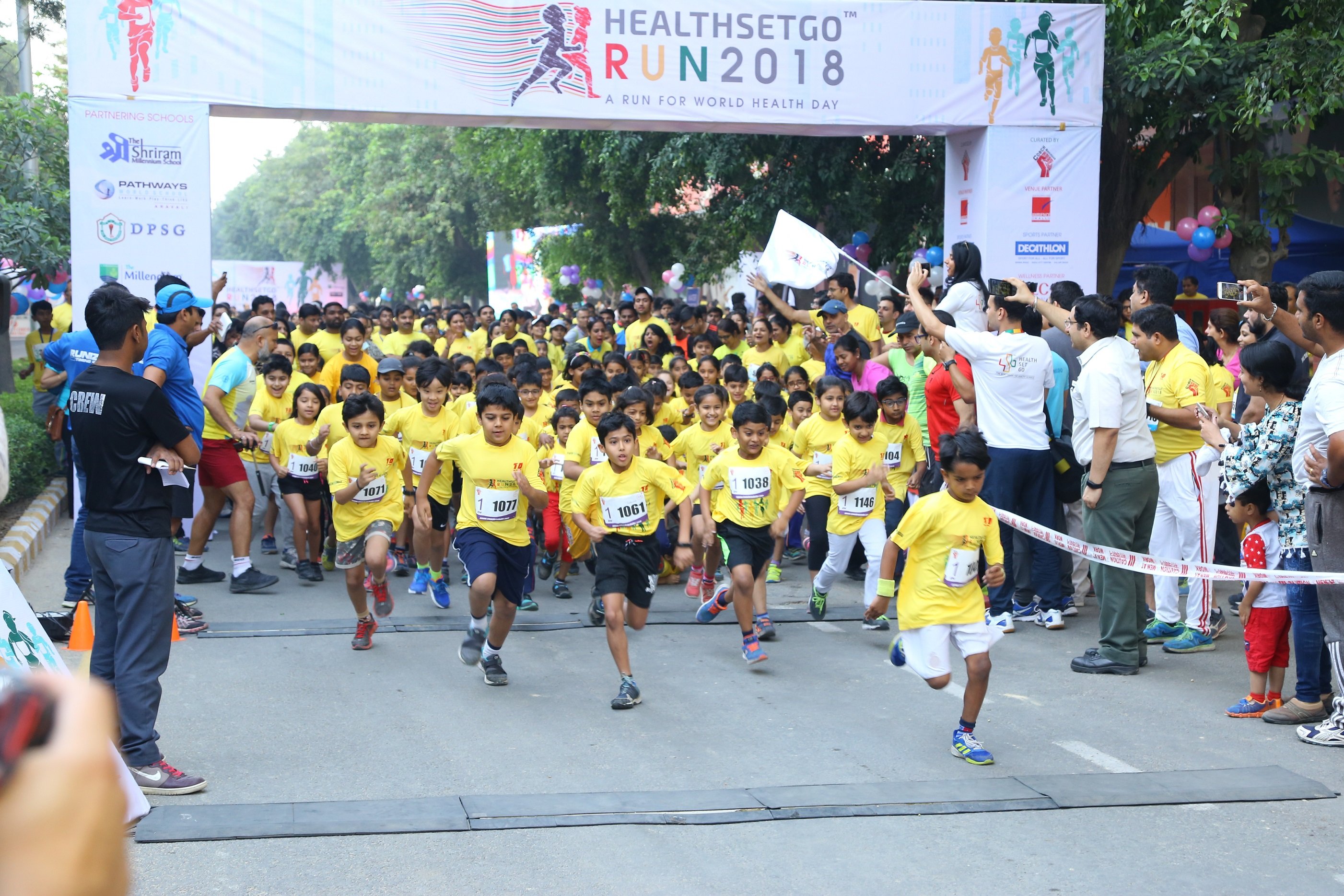 A group of children running a race
